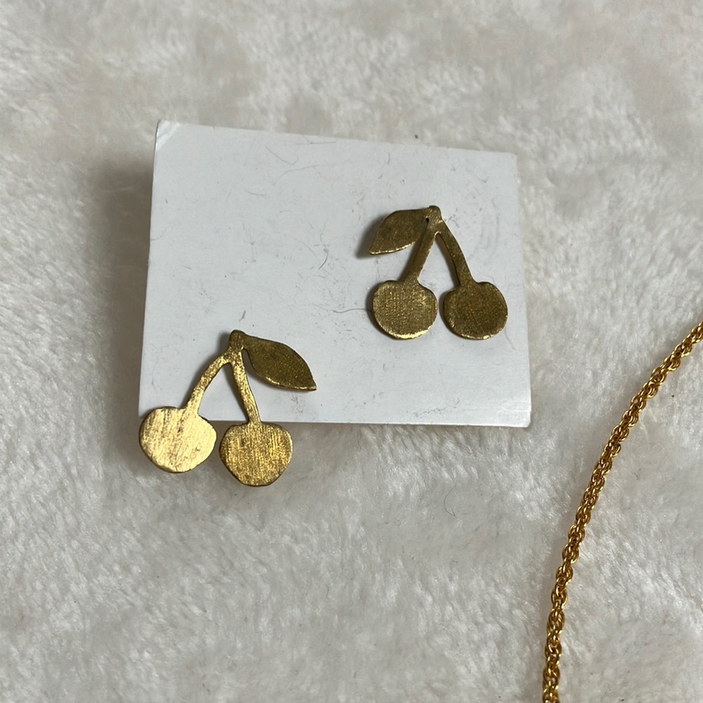 Cute stamped metal studs with cherry 🍒 motif. Earring backs plastic for comfort